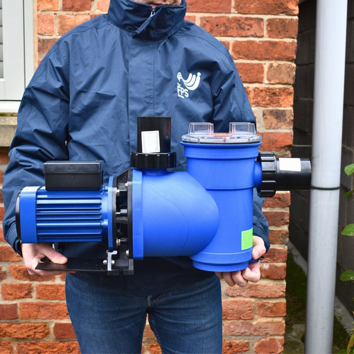 Pump Engineer holding Plastica AV Swimming Pool Pump with FPS Group Jacket on for Flood and Water Pumps