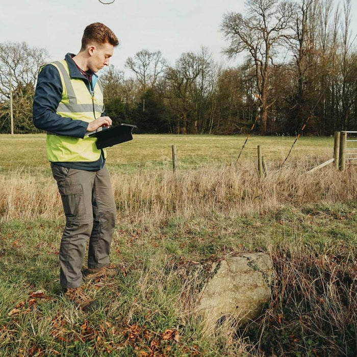 Flood Surveyor reviewing site using ipad