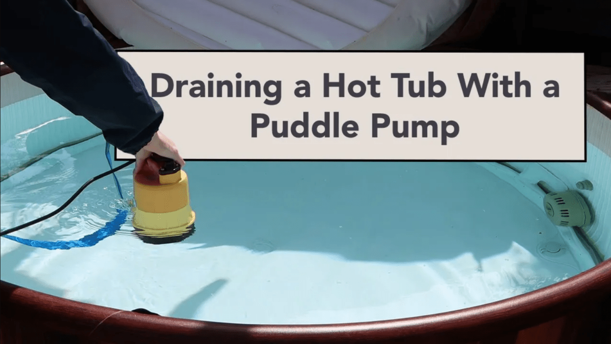 Draining a hot tub using a puddle pump