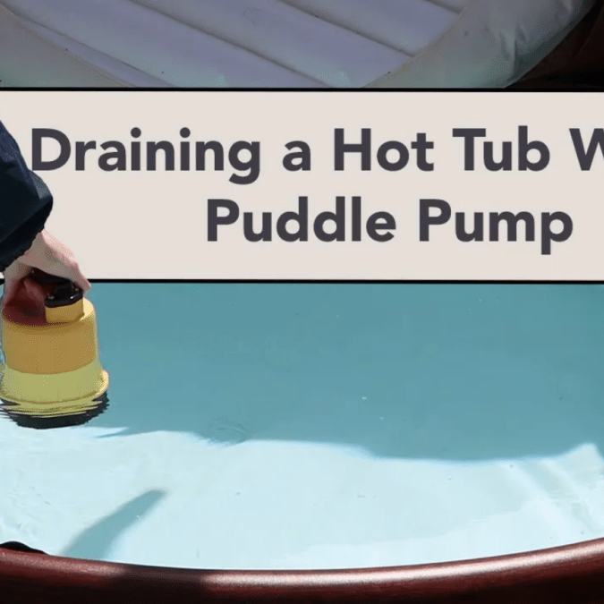 Draining a hot tub using a puddle pump