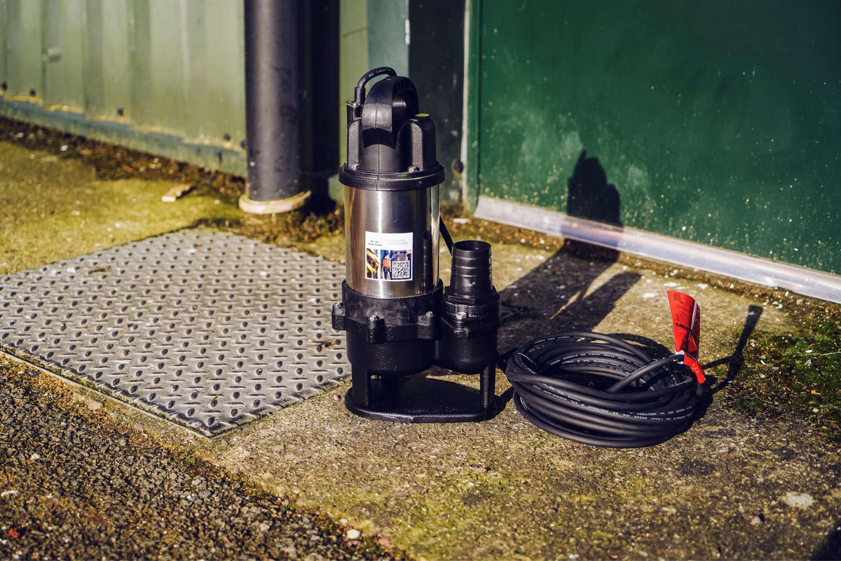 Sewage Pump next to manhole cover