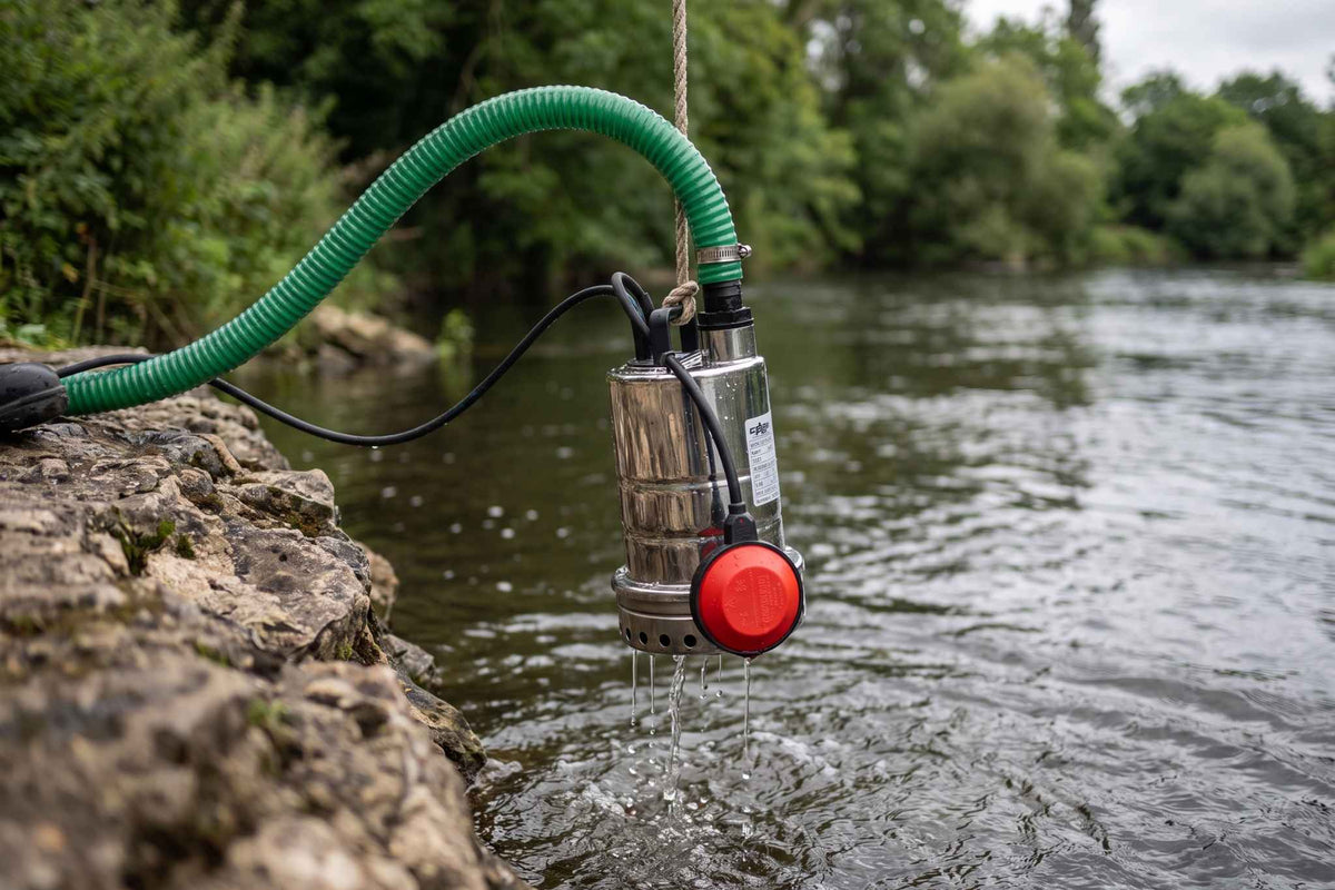 Mizar Pump in river with green suction delivery hose