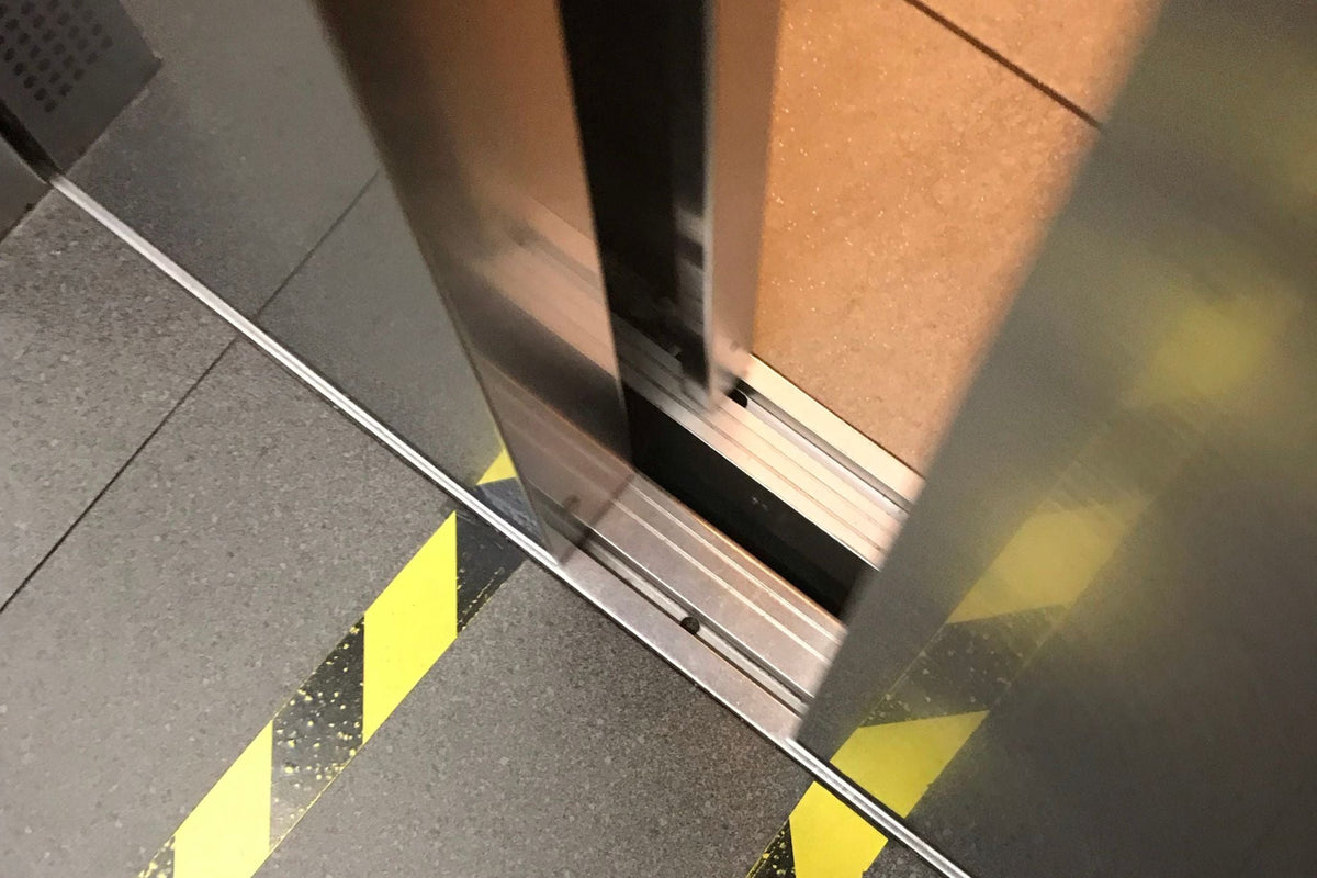 Floor of a lift with doors slightly open