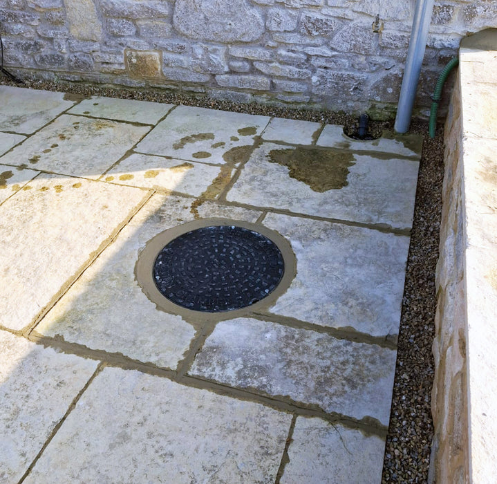 Sump Pump discreetly installed into patio