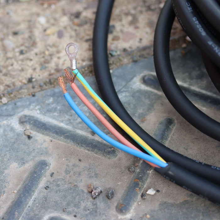 Close-up of electrical wires with colored insulation on a metal surface