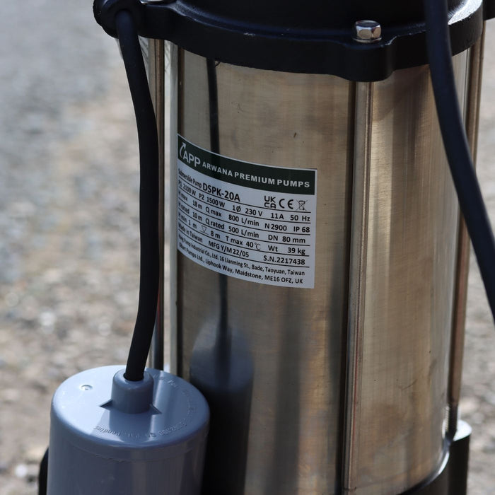 automatic sewage pump with a technical label on a blurred background