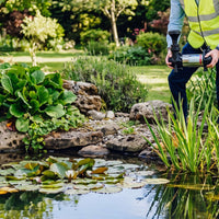 APP MH Water pump being placed into pond