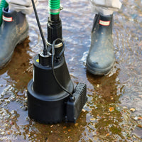 APP RS40EA water pump in water next to person wearing wellies