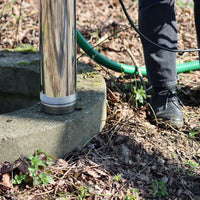 base of acuatec well pump sat next to well opening 