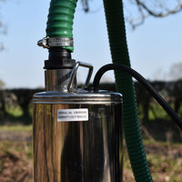 green hose connected to acuatec borehole pump