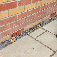 two anti flood air bricks fitted to side of house