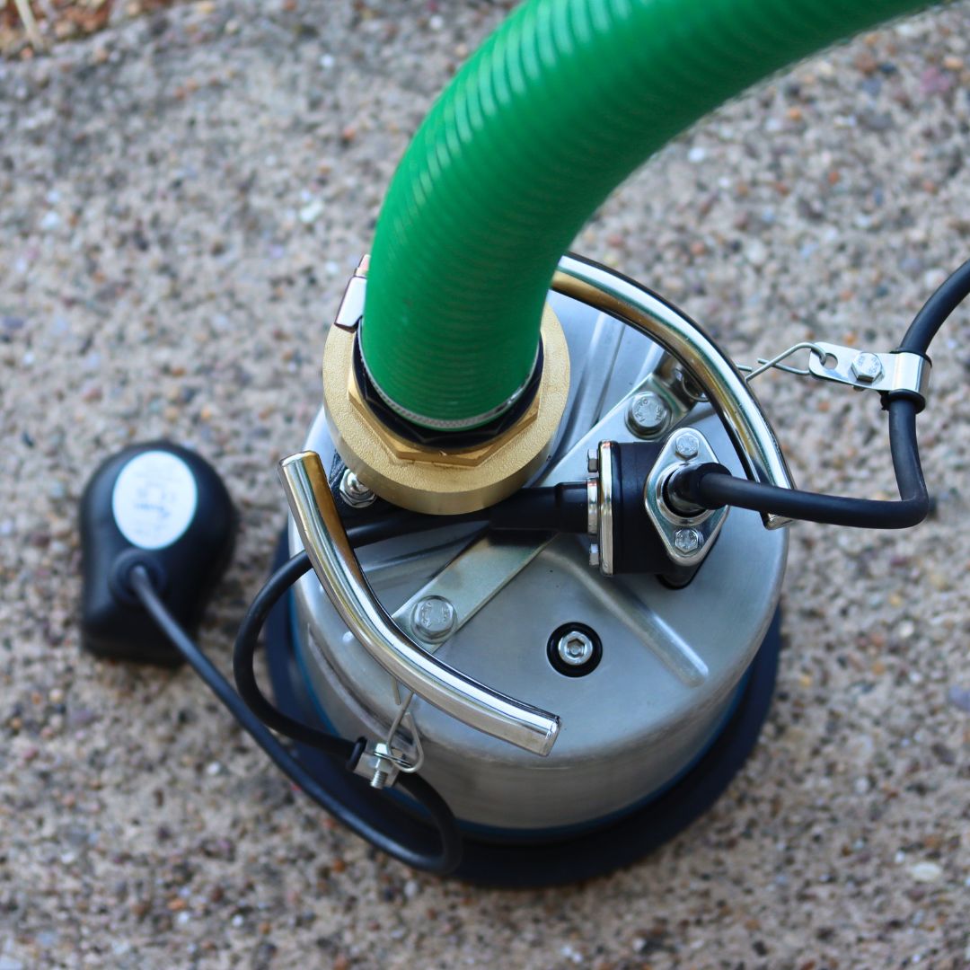 Top view of Evak residox automatic puddle pump and non return value fitted to suction and delivery hose pipe