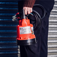 Compact 12V Baby Battery Water Pump held by woman and complete with crocodile clips