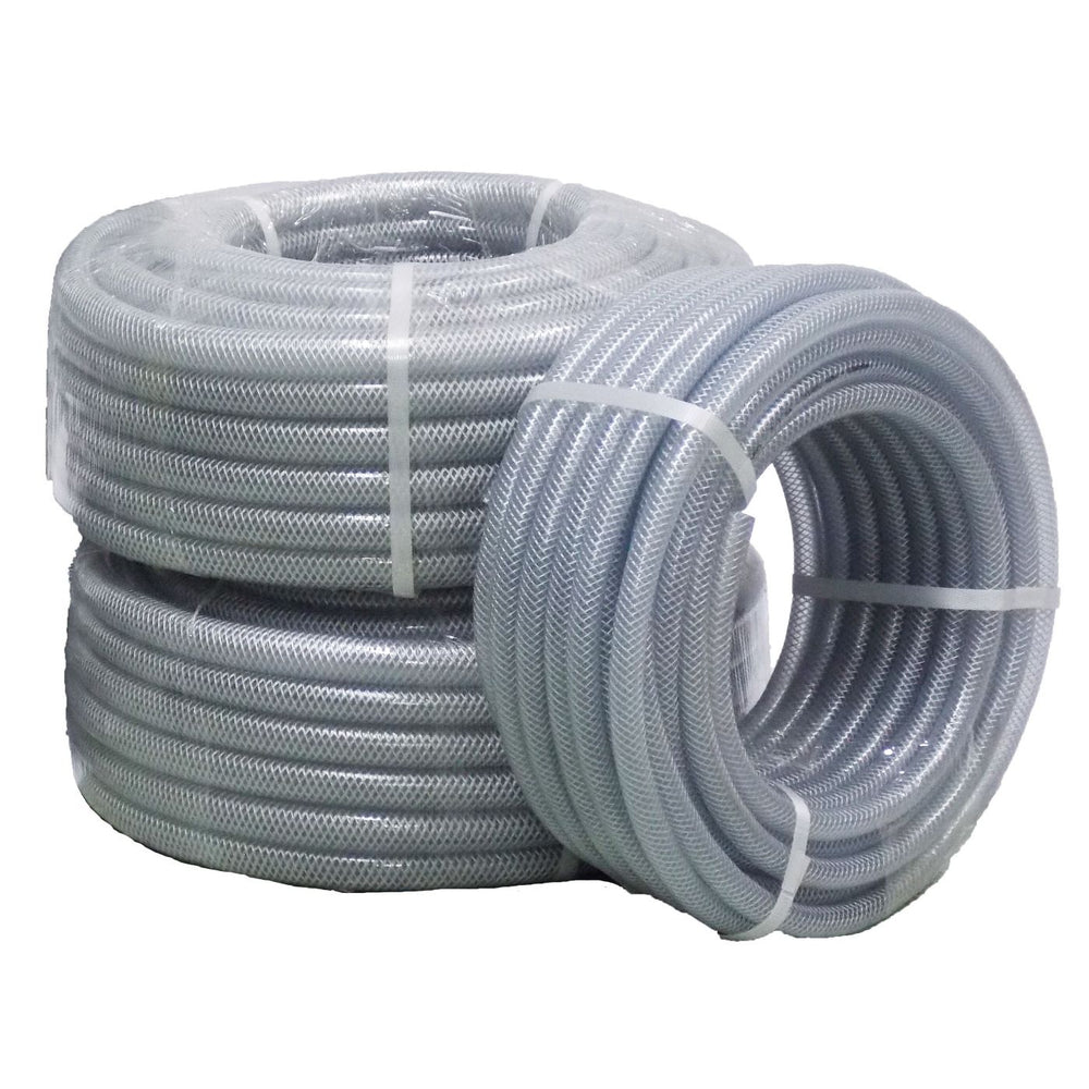 Three coiled rolls of translucent clear flexible braided hose pipe