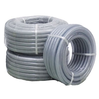 Three coiled rolls of translucent clear flexible braided hose pipe