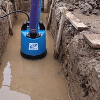 Tsurumi contractor LB480 submersible pump installed in a muddy trench with muddy water