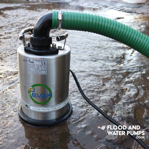 Flood pump with a green hose on a wet surface, branded 'Evak Residox'.