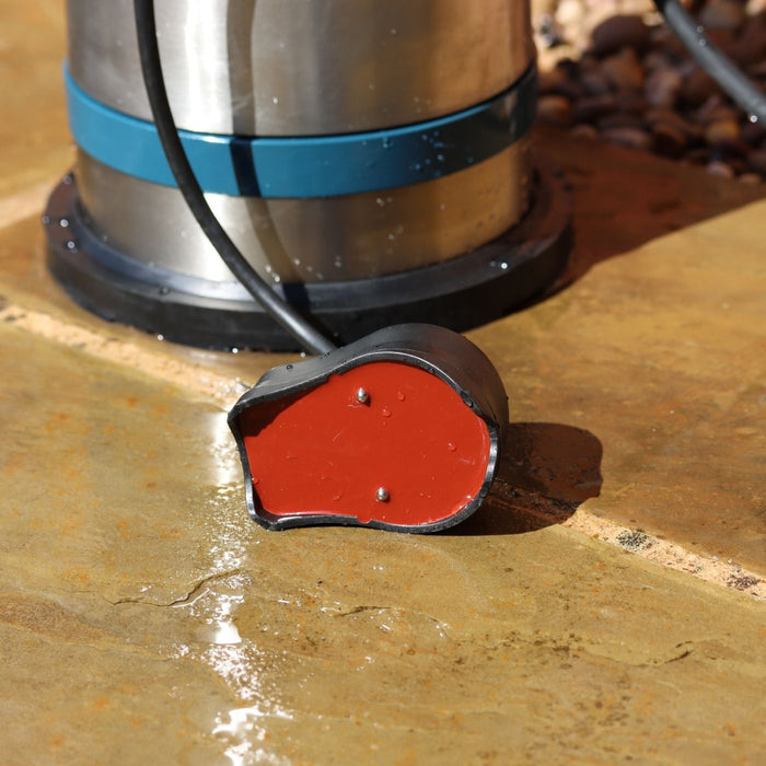 close up of red base of Evak residox crab sensor with metal prongs on wet ground