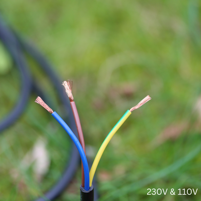 Electrical wires, labeled 230V & 110V, against a blurred green background.