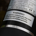 Close-up of a warning label on FL Demand surface water pump