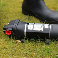 FL Demand surface water pump on grass, black boot in background