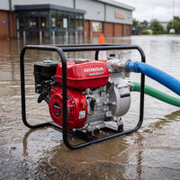 Honda water pump in action during a flood with hoses attached.