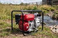 Honda WB20XT lifestyle shot next to river for farm irrigation