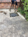 Sump Pump chamber being installed in driveway for flood mitigation