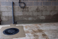 Sump Chamber installed into concrete floor with pipework and waterproofing