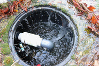 Sump Pump pictured with flood water entering the chamber
