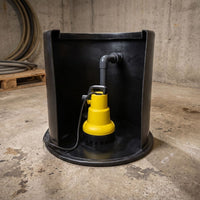 Yellow AMA Drainer 301 as part of packaged pump station pictured in a basement