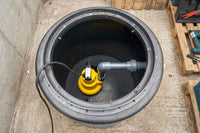 Sump Chamber with AMA Drainer 301 on basement floor.