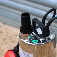 Close-up of stainless steel automatic water pump with hose tail 