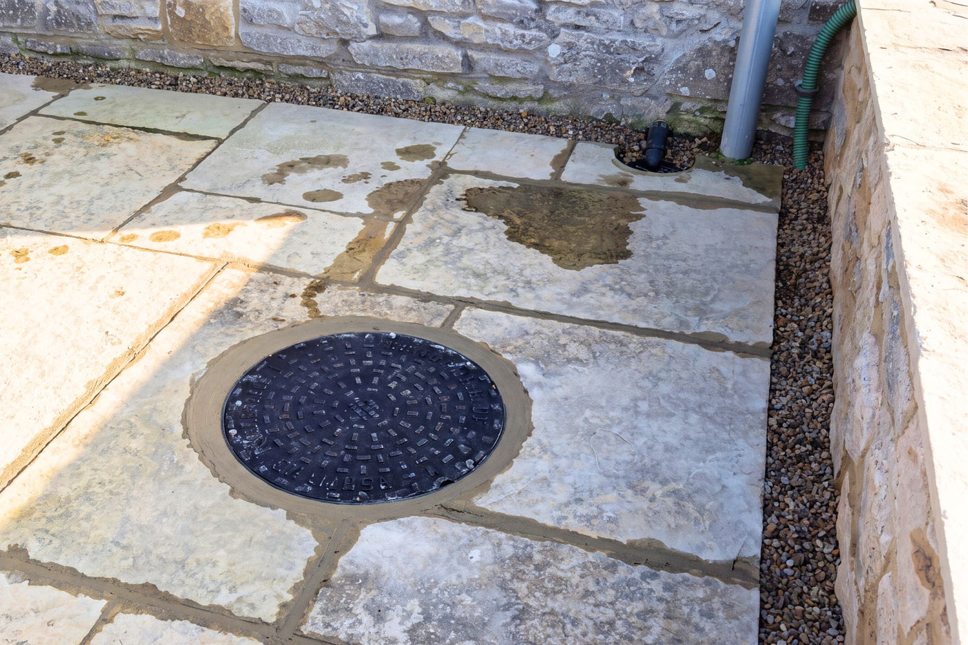 Packaged Pump Station installed behind a Flood Wall into a patio to provide "passive" pumping. The pump will activate during a flood using the float switch.