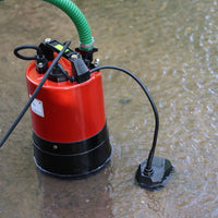 Red water pump with automatic floor sensor in flood water