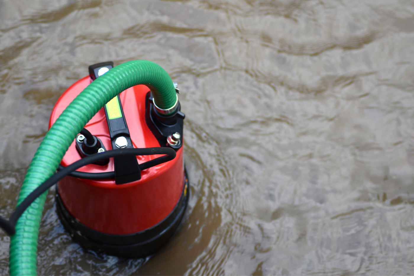 Stream SPK530 puddle pump with Suction and Delivery Hose attached.