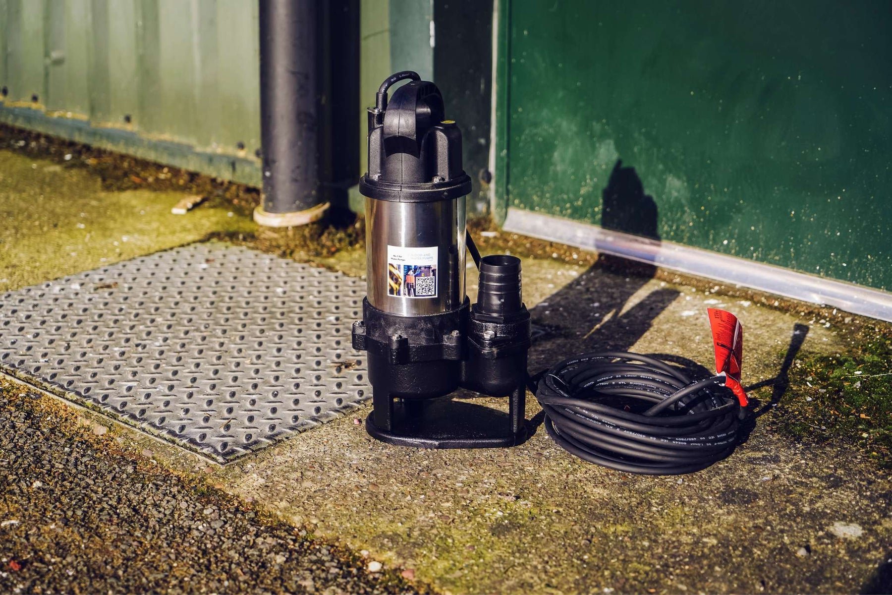 APP SV Submersible Sewage Pump pictured with manhole lid outside building