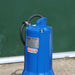 Blue submersible sewage pump with 'Speroni' branding against a green background