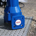 Blue SPERONI sticker on sewage water pump on a manhole cover with a blurred background