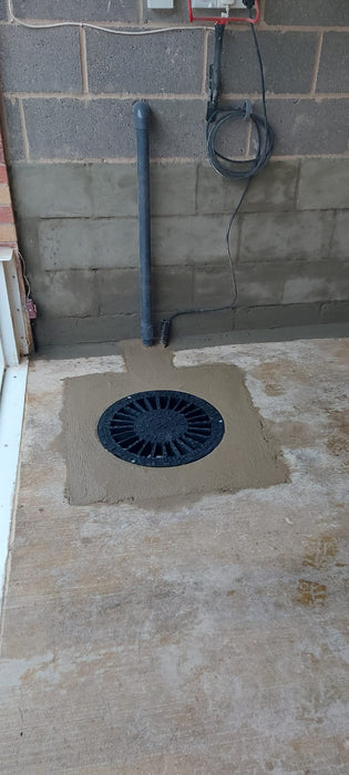 Sump Pump in garage floor for flood mitigation