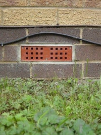 Brown Anti Flood Air Brick shown in a wall