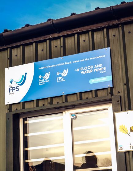 Banner for FPS Flood and Water Pumps on a building exterior