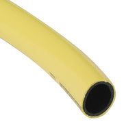 A close-up of a yellow industrial hose showing its circular cross-section with a black inner lining, set against a plain white background.