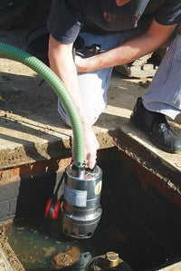 mizar chemical resistant stainless steel water pump being placed in chamber