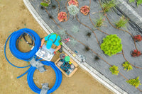 person setting up irrigation system