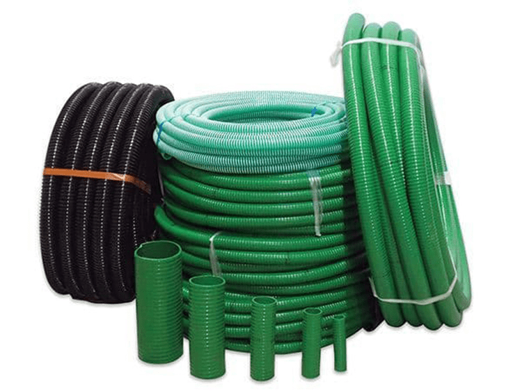 A collection of green and black suction and delivery hoses in different widths