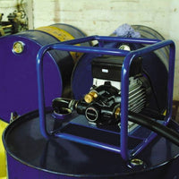 Oil lubricant pump sat on top of  oil barrel